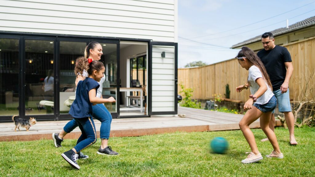 Family playing outside 1024x576 1 Creating a Child-Friendly Airbnb: Tips for Hosts