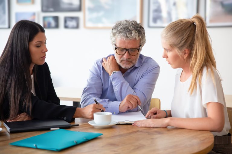 family legal advisor explaining document details mature father adult daughter 1 The Role of Family Lawyers in Dubai’s Multicultural Legal Landscape