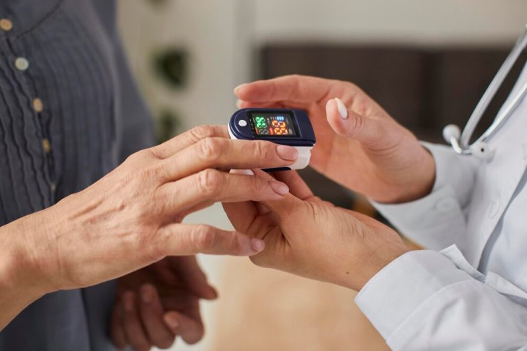 covid recovery center female doctor checking elder patient s oxygen level 23 2148847834 How Locum GPs Can Navigate Sydney's Diverse Medical Communities