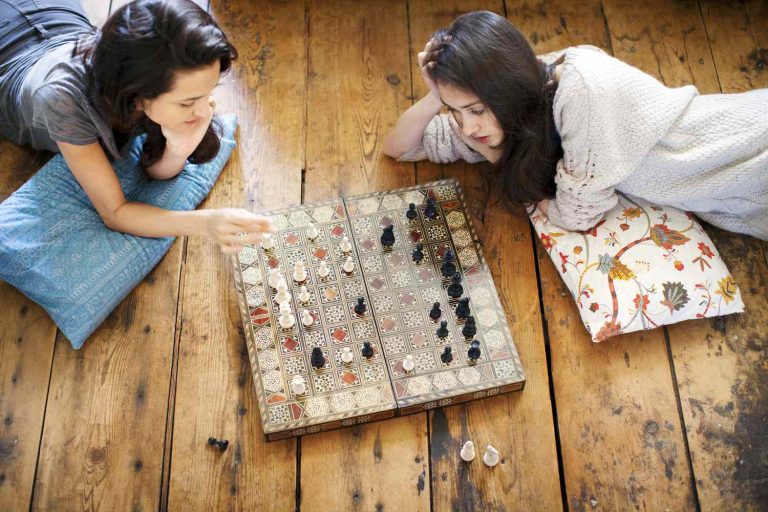 game night GettyImages 961600142 fb745b10310b4b88ac290ca5db3dd78c Luxury Style Is a Tool for Playing the Dating Status Game