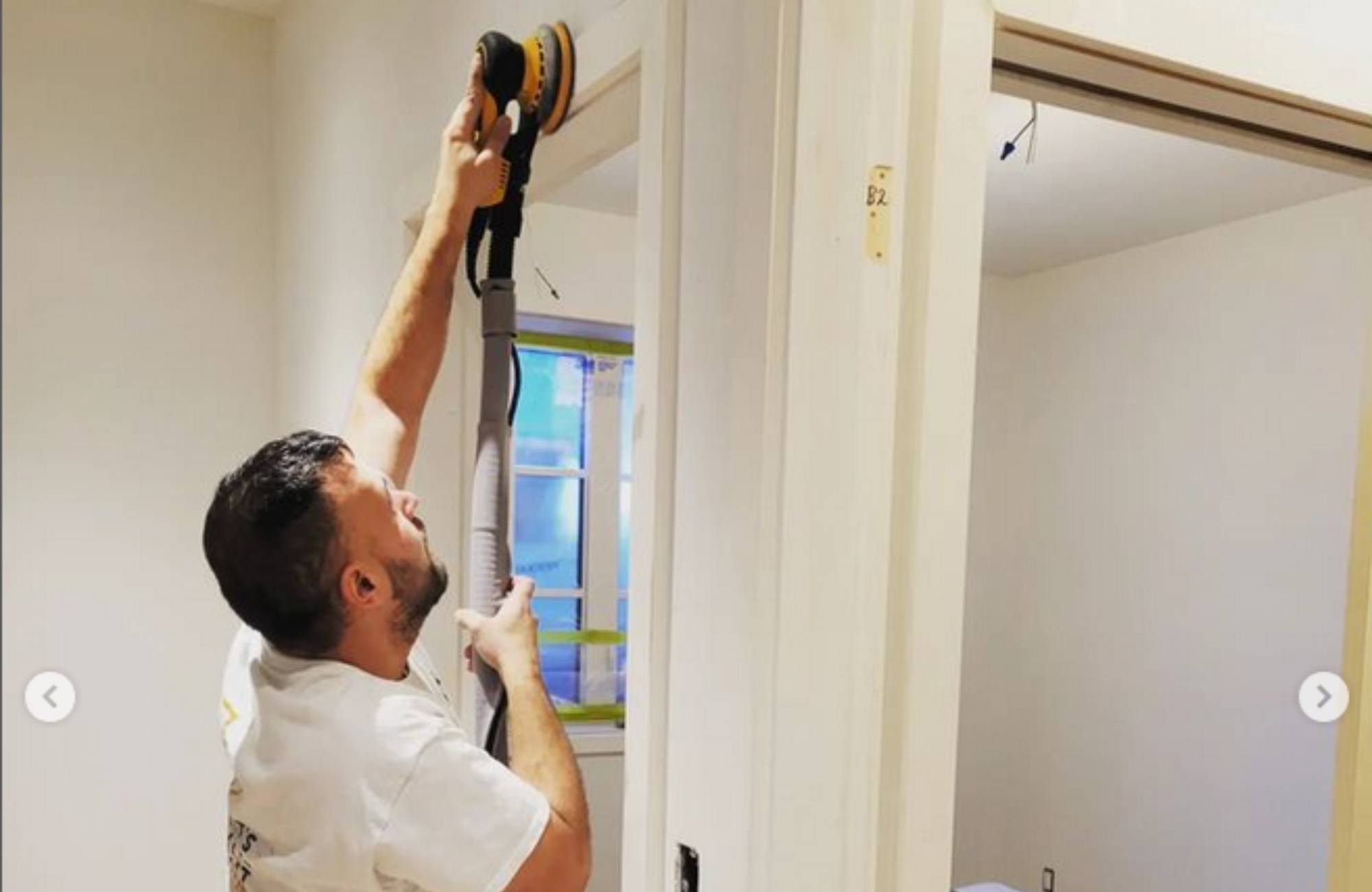working the paint roller inside a home How Professional Painting Transforms Residential Spaces