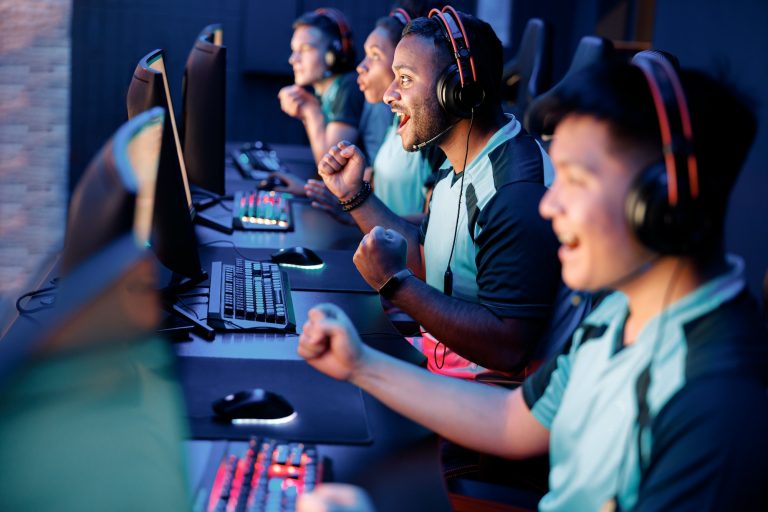 young gamers involved in online video game at cyber club Enjoy the Best Multiplayer Fun with Online Adventures