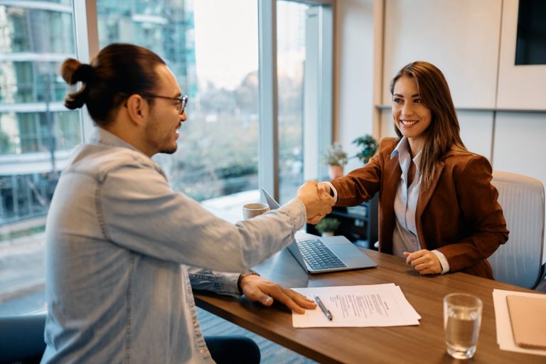 businesswoman shaking hands job candidate The Smart Way to Start or Shift Your Career in Today’s Economy