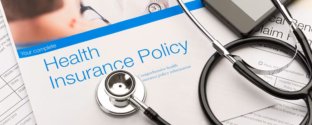 What is a Health Insurance Policy? Features & Benefits Explained 1 health insurance policy booklet and stethescope What is a Health Insurance Policy? Features & Benefits Explained