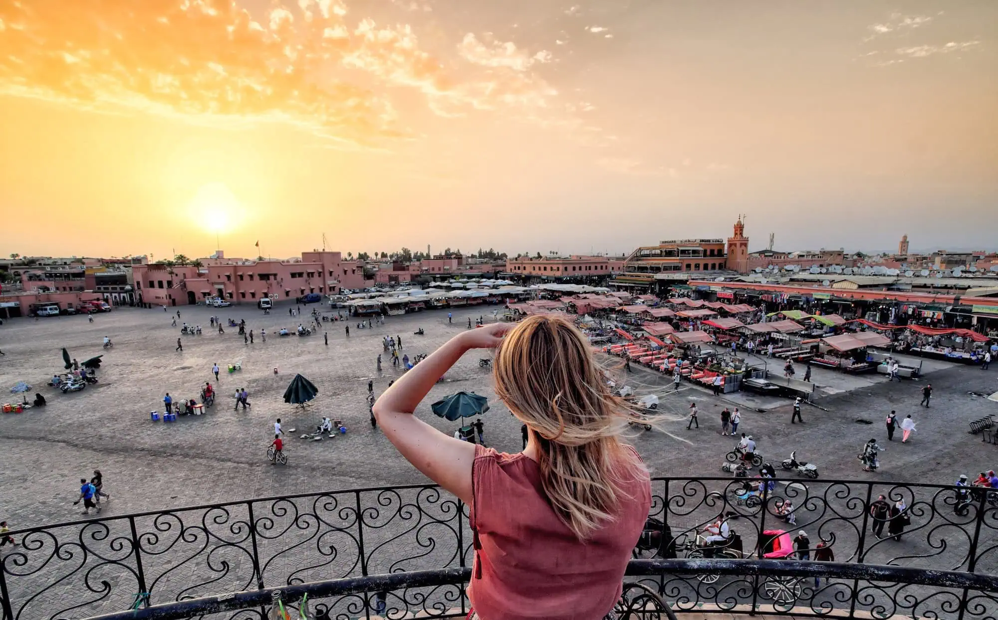 Morocco eVisa Requirements: What Modern Travelers Should Know Before Planning the Perfect Trip 1 Tourist watching over Jamaa el Fna Market Marrakesh Morocco 1 Morocco eVisa Requirements: What Modern Travelers Should Know Before Planning the Perfect Trip